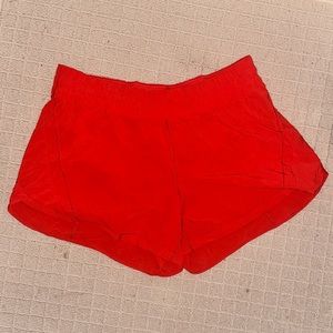 Lululemon track that 5” short in “love red”